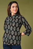 Black and blue floral summer printed short cotton kurti for jean with collar neck.
•	Straight short kurti with floral prints all over.
•	3/4 sleeves, wooden buttons.
•	Collared neck.
•	Pure cotton material.
