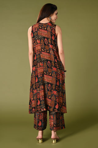 Black printed coord set with high closed neck and matching wide leg pants.
•	Floral prints all over the top.
•	High close neck with button, sleeveless, sleeves comes separately with the top.
•	Matching printed bottom wide leg pants with double sided elastic.
•	Chanderi rayon material.

