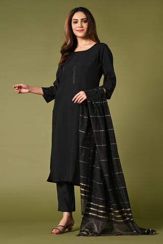 Plain black mirror worked straight cut set with zari woven dupatta and straight pants.
•	Plain top with mirror-work in neckline and back neck.
•	3/4 sleeves with mirror and thread work in border.
•	Single side elastic comfortable straight pants.
•	Matching black zari woven dupatta.
•	Chanderi material.
