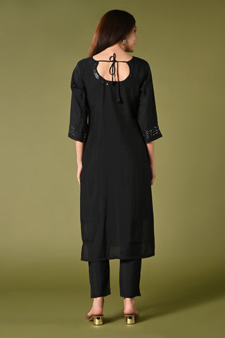 Plain black mirror worked straight cut set with zari woven dupatta and straight pants.
•	Plain top with mirror-work in neckline and back neck.
•	3/4 sleeves with mirror and thread work in border.
•	Single side elastic comfortable straight pants.
•	Matching black zari woven dupatta.
•	Chanderi material.

