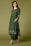 Solid green muslin kurti set with elephant print in border and sleeves.
•	Plain colour kurti with elephant prints in border and sleeve.
•	Round neck & 3/4 sleeves.
•	Double sided elastic and comfortable straight fit pants.
•	The green colour muslin with elephant prints will give a perfect occasional vibe.
